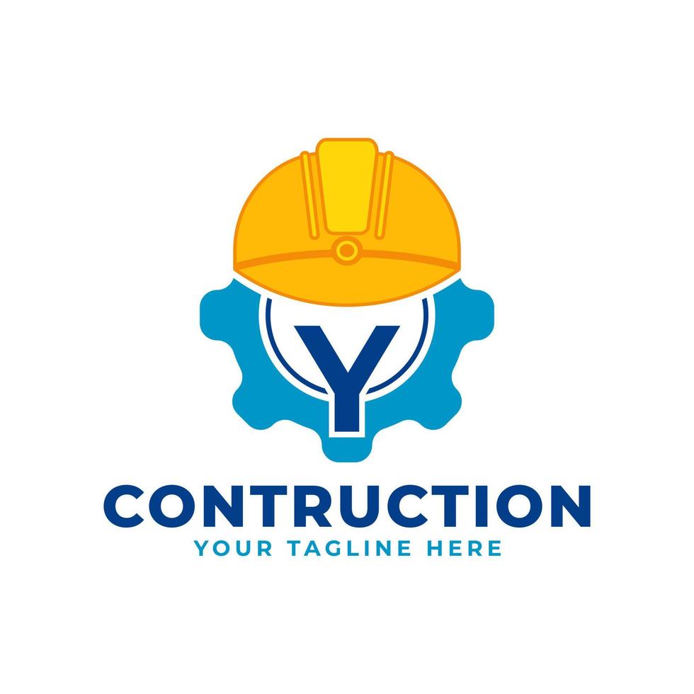 letra inicial y con equipo y casco. concepto de logotipo de construcción e ingeniería vector