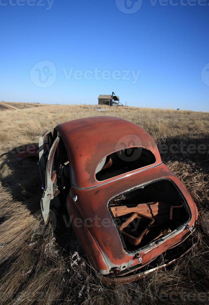 Old Abandoned Car in Field Saskatchewan Canada photo