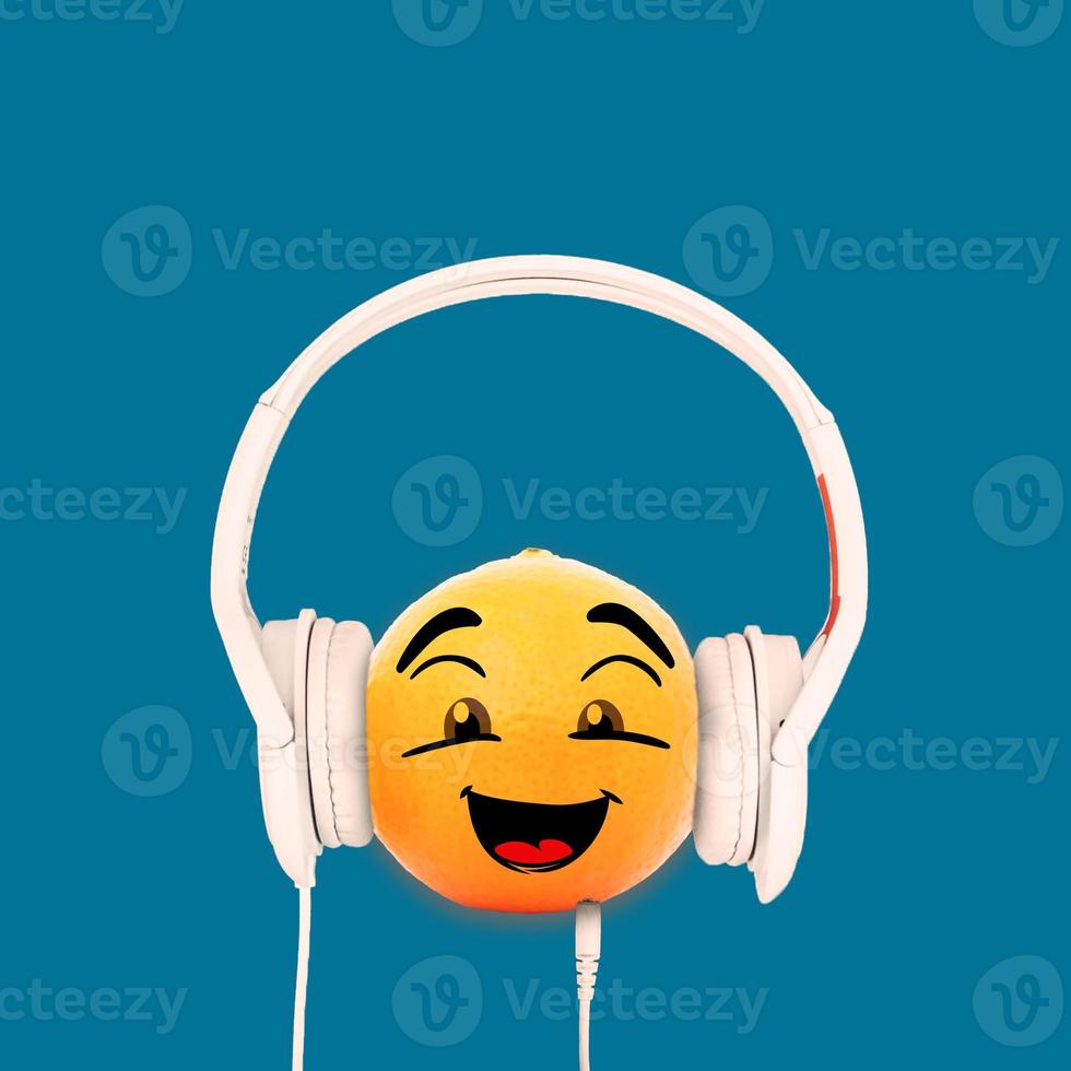 happy oranges while using headphones photo