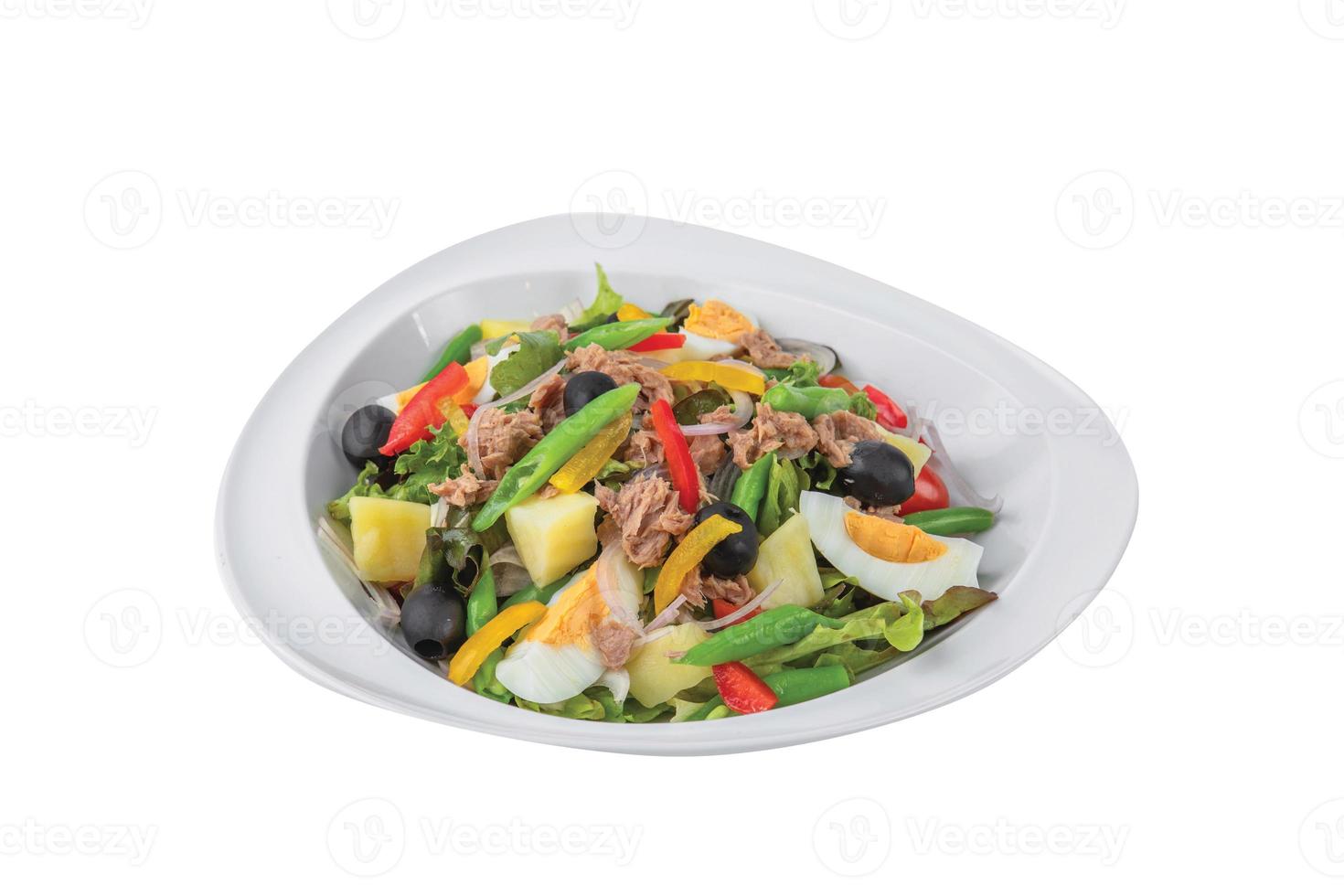 Tuna salad with boiled egg, tomato, lettuce, corn and red onion. Healthy and detox food concept. Ketogenic diet. Fresh vegetable salad bowl on white background. Banner photo