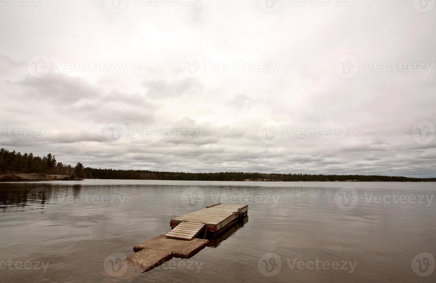 Boat dock on Northern Manitoba lake photo