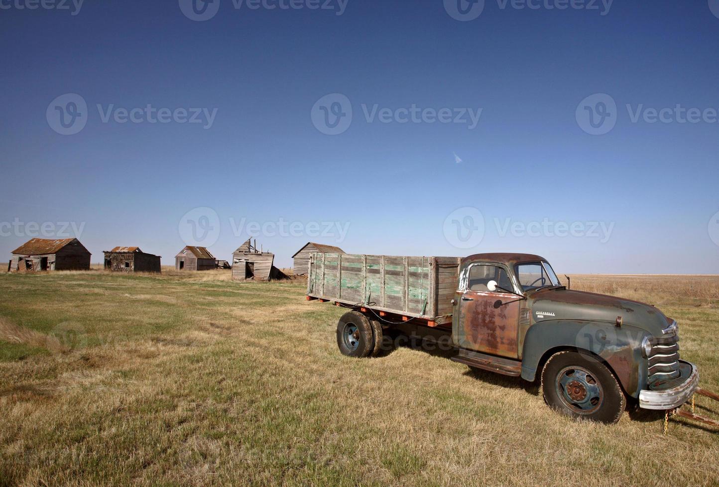 Antique Chevy farm truck in old farmyard photo