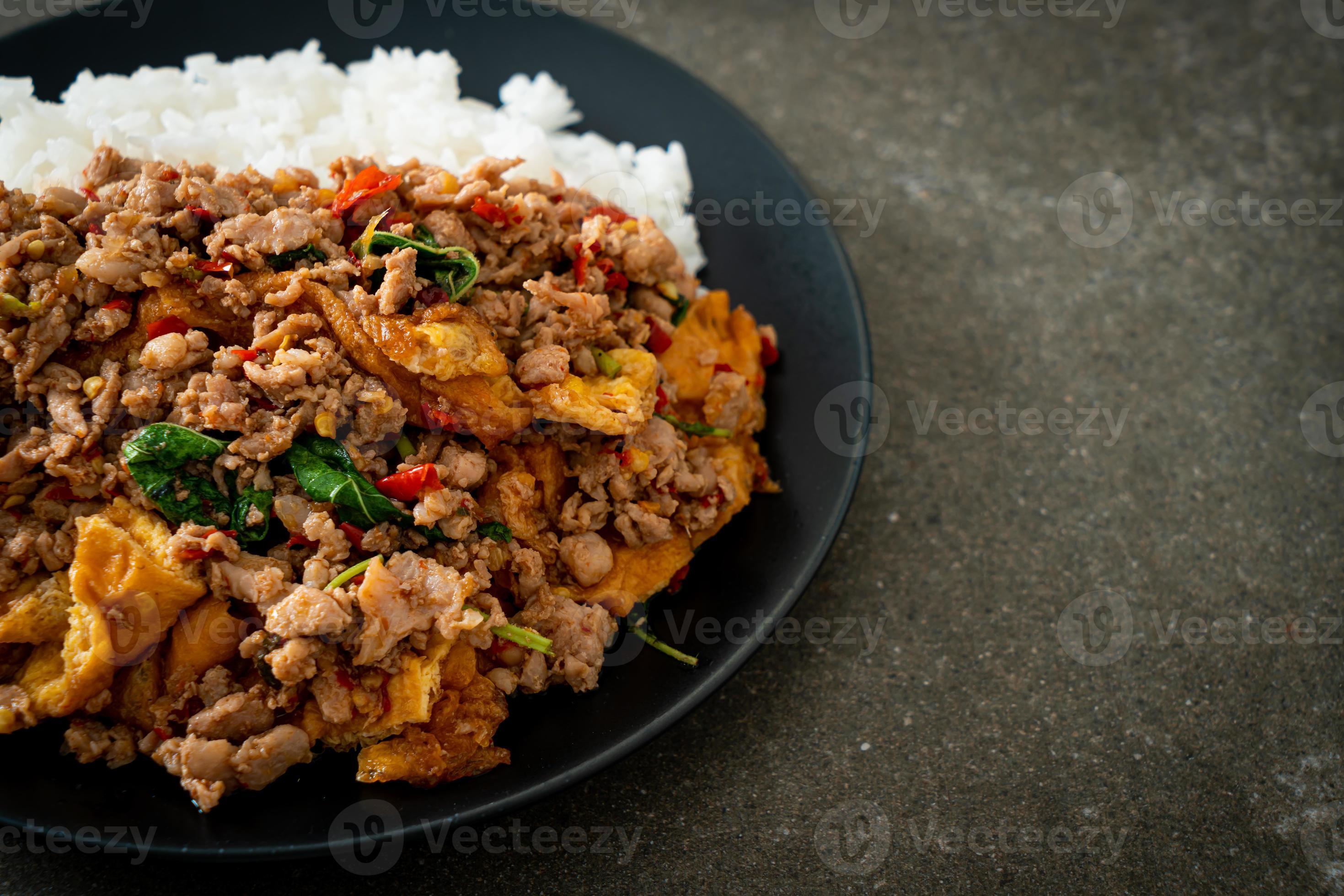 stirfried minced pork with basil and egg topped on rice 6238661 Stock