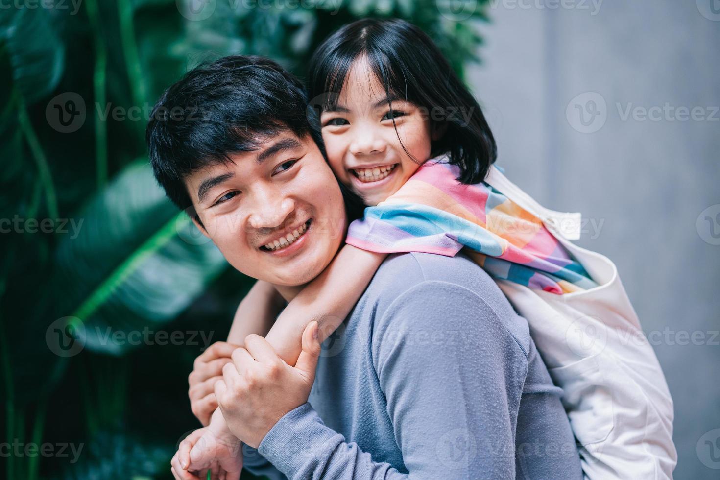 Asian father and daughter at home photo