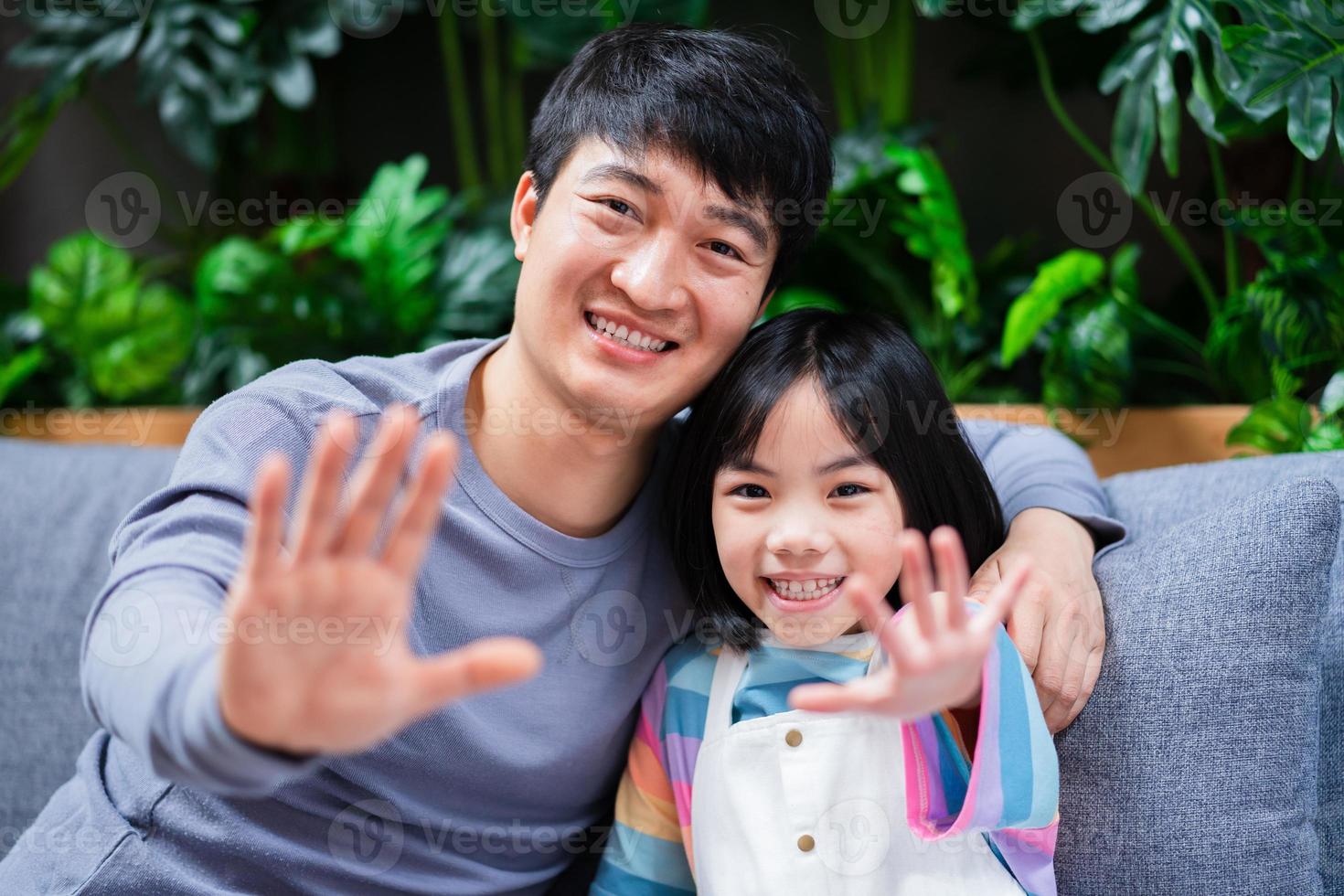 Asian father and daughter at home photo