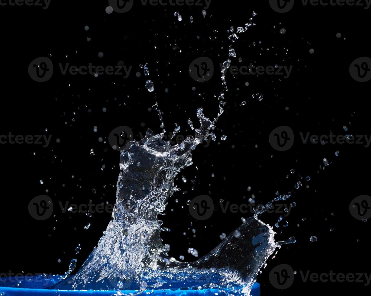 Splash water, water splashes, isolated on black background photo