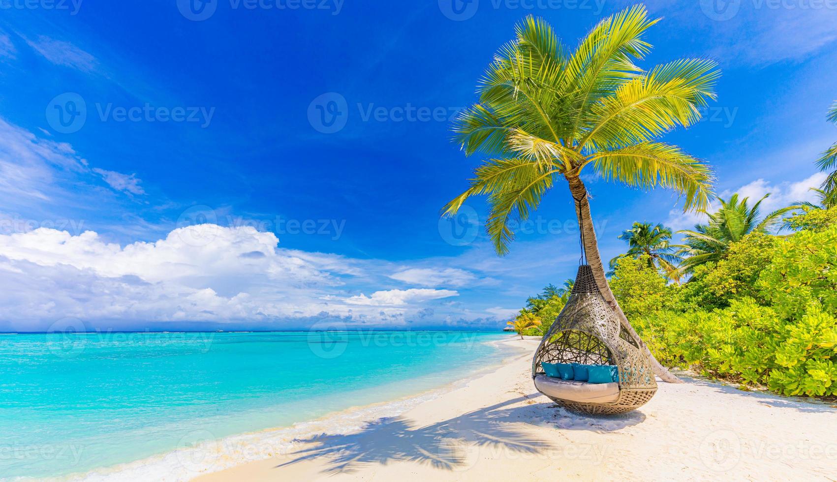 Tropical beach paradise as summer landscape with beach swing or hammock and white sand, calm sea serene beach. Luxury beach vacation summer holiday. Tranquil romantic island nature travel destination photo