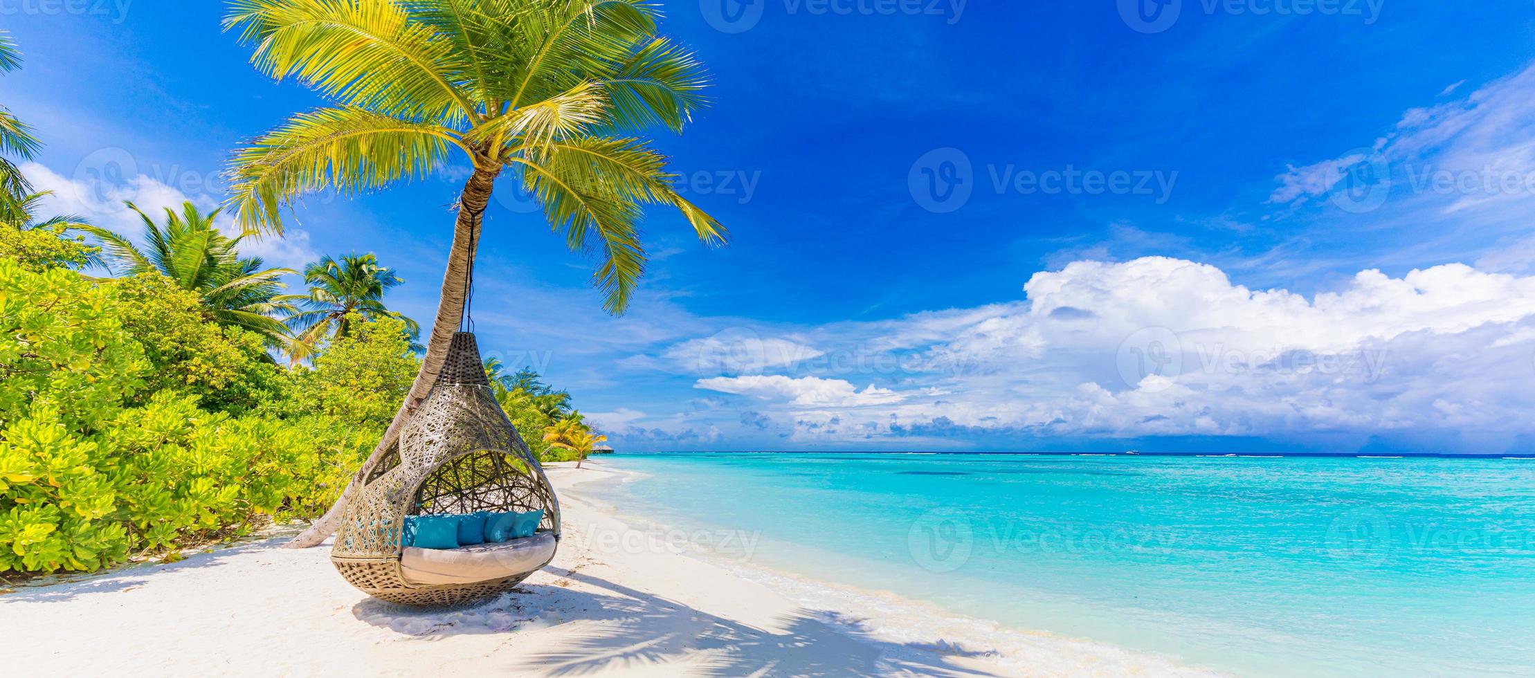 Tropical beach paradise as summer landscape with beach swing or hammock and white sand, calm sea serene beach. Luxury beach vacation summer holiday. Tranquil romantic island nature travel destination photo