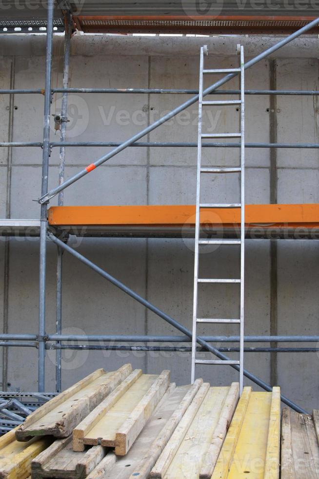 building or construction site with scaffold and ladder photo