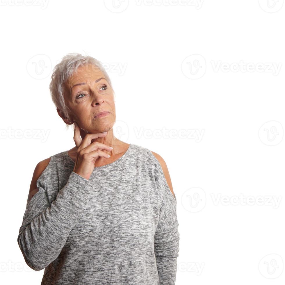 concerned mature woman looking up photo