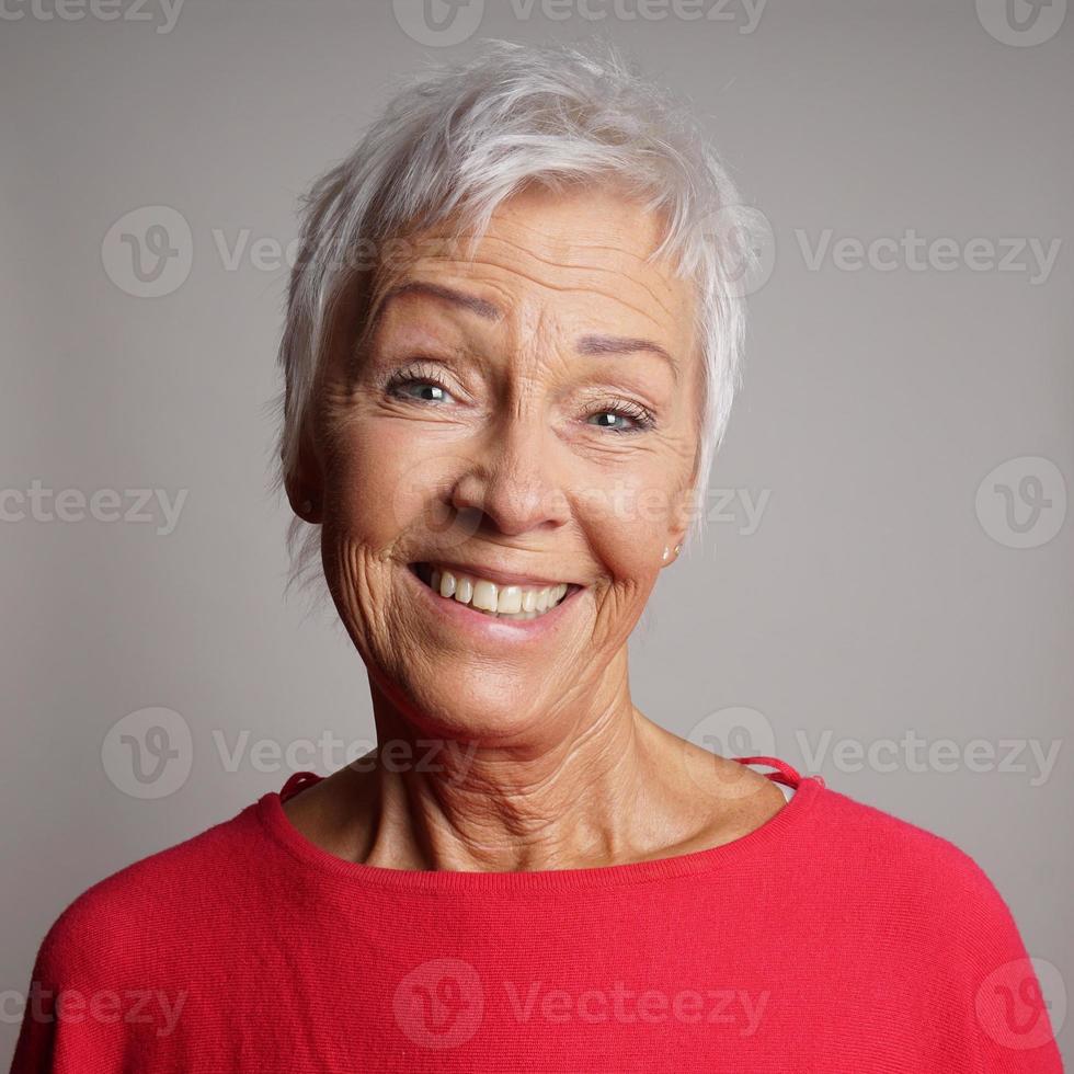 happy older woman in her 60s photo