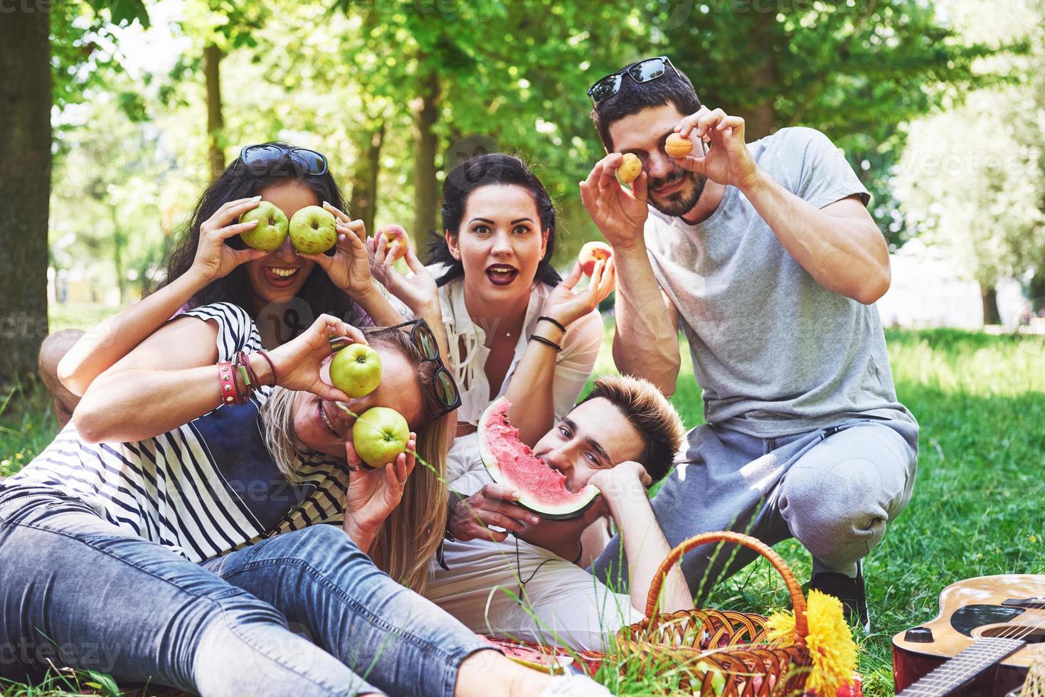 Happy friends having fun outside in nature photo