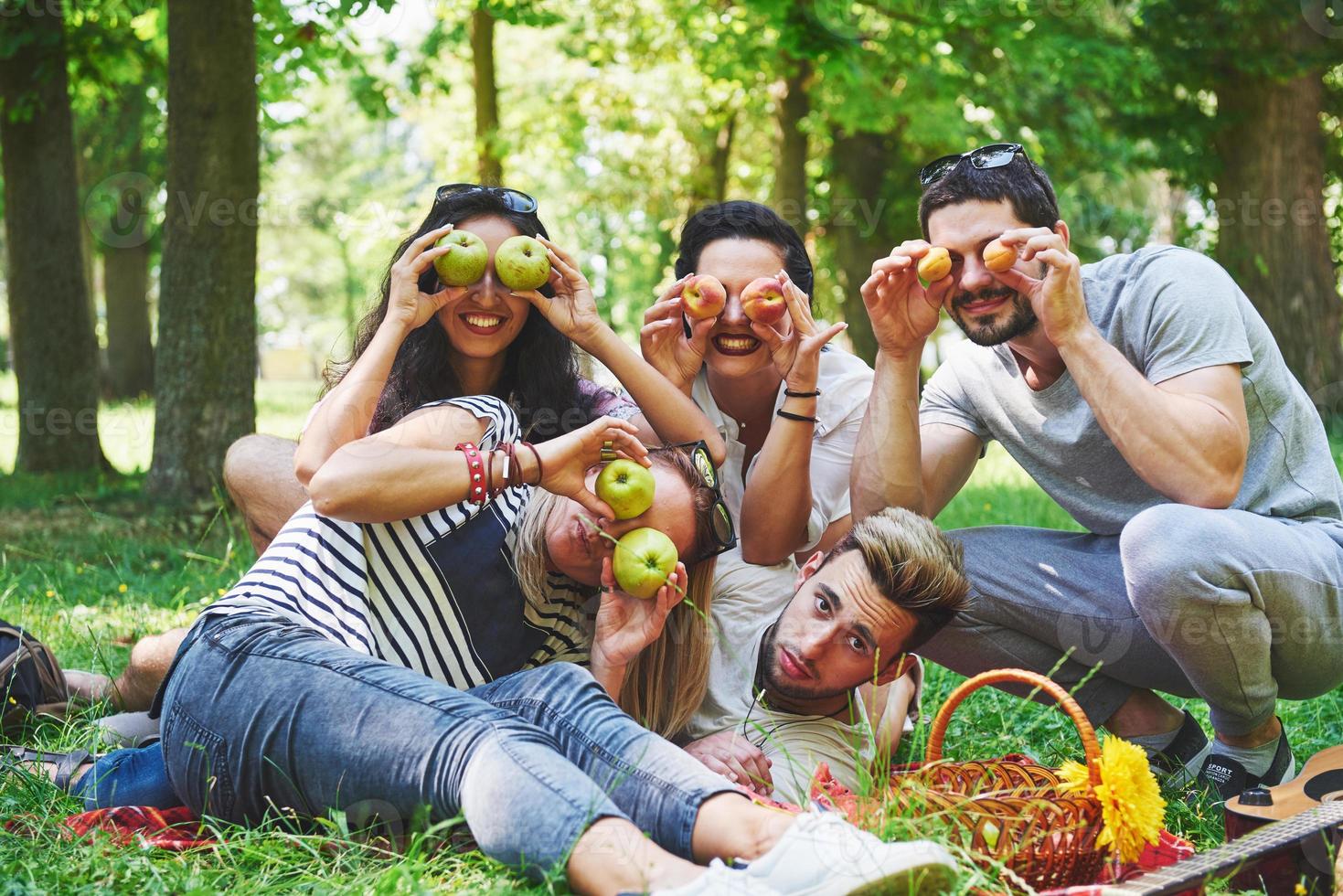 Happy friends having fun outside in nature photo