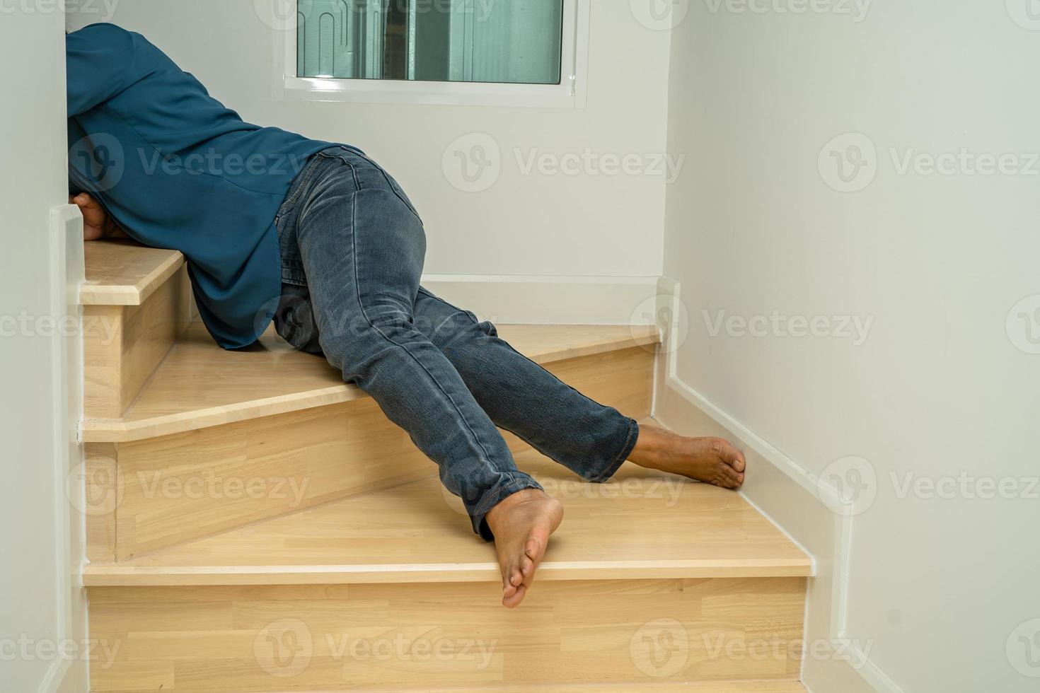 Asian lady woman patient fall down the stairs because slippery surfaces photo