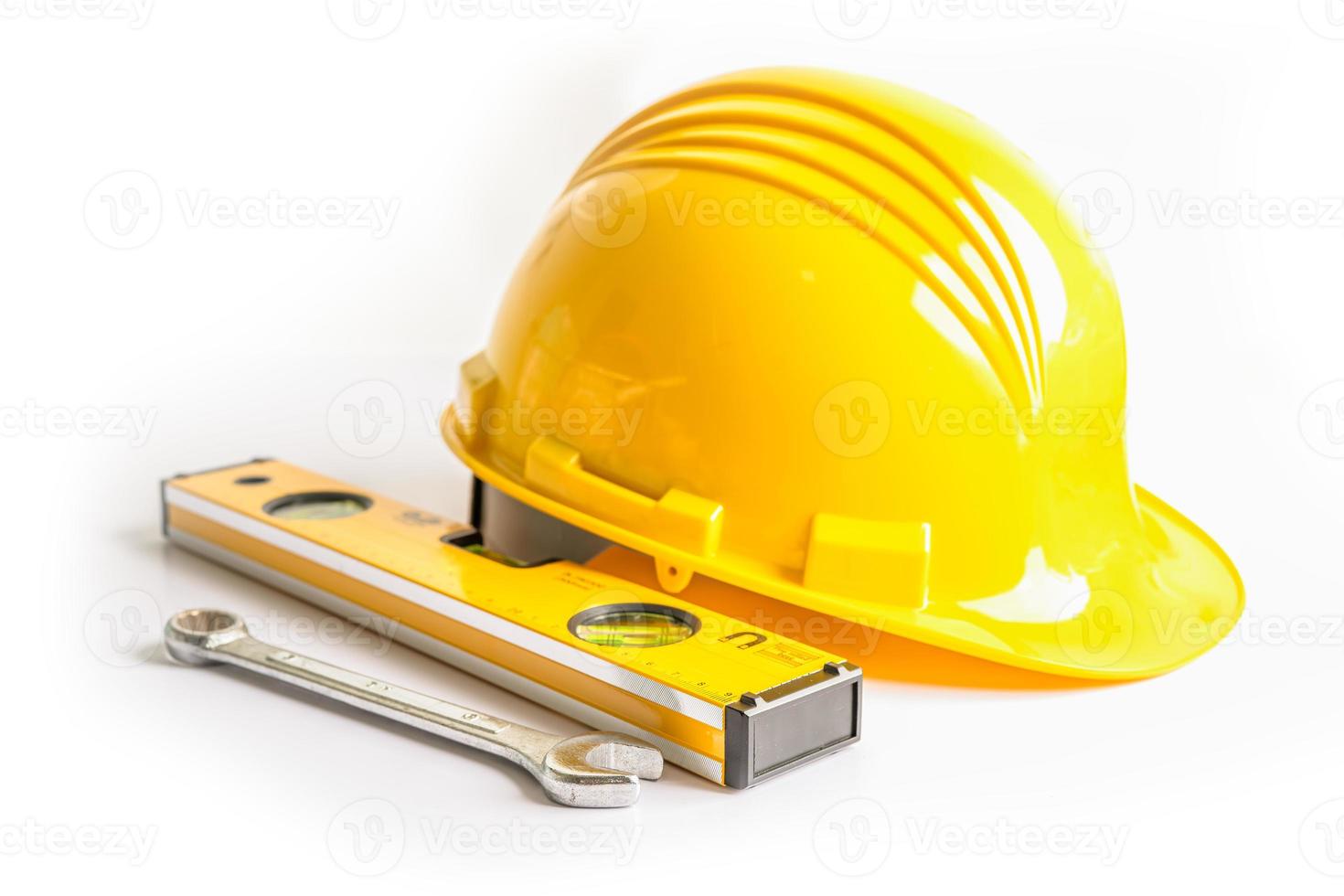 Construction helmet and tools for engineering work project on white background. photo