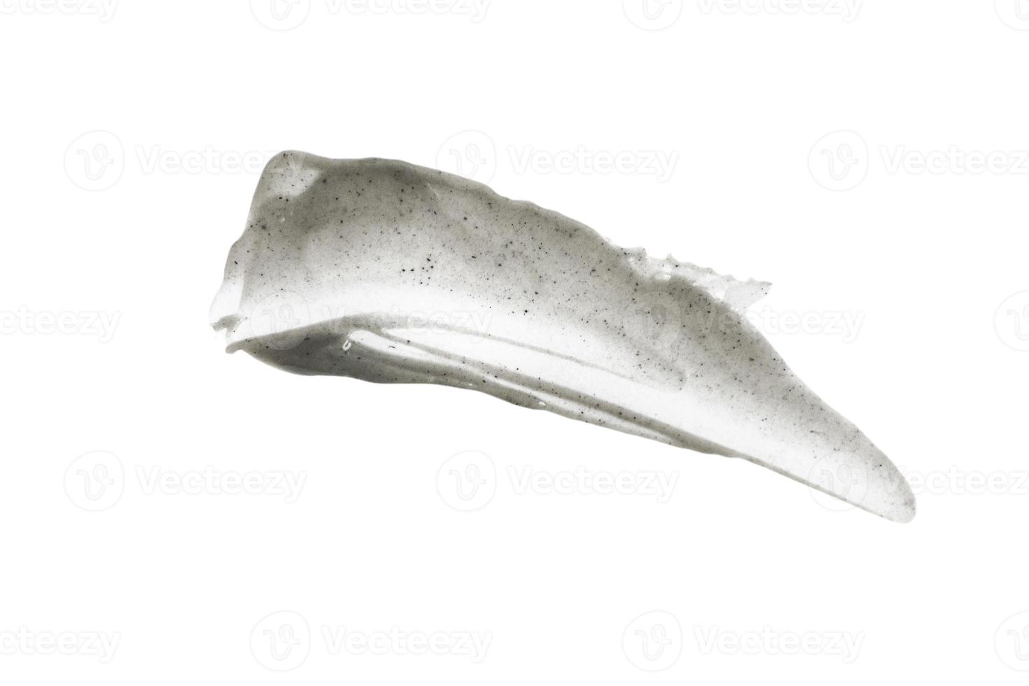 Black and gray smear with scrub effect, cream on a white background photo