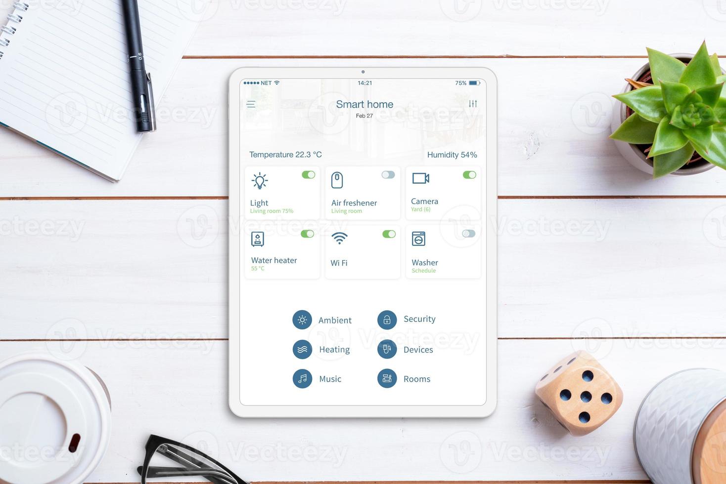 Smart home control app on tablet display. Home desk, top view, flat lay. Modern concept of home automatization app photo