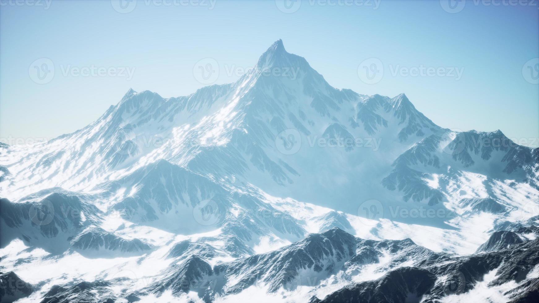 panoramic mountain view of snow capped peaks and glaciers photo