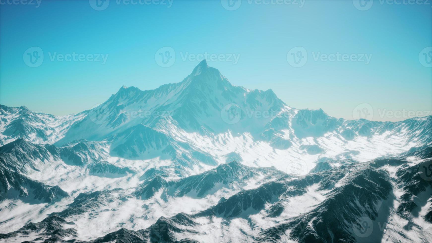 panoramic mountain view of snow capped peaks and glaciers photo