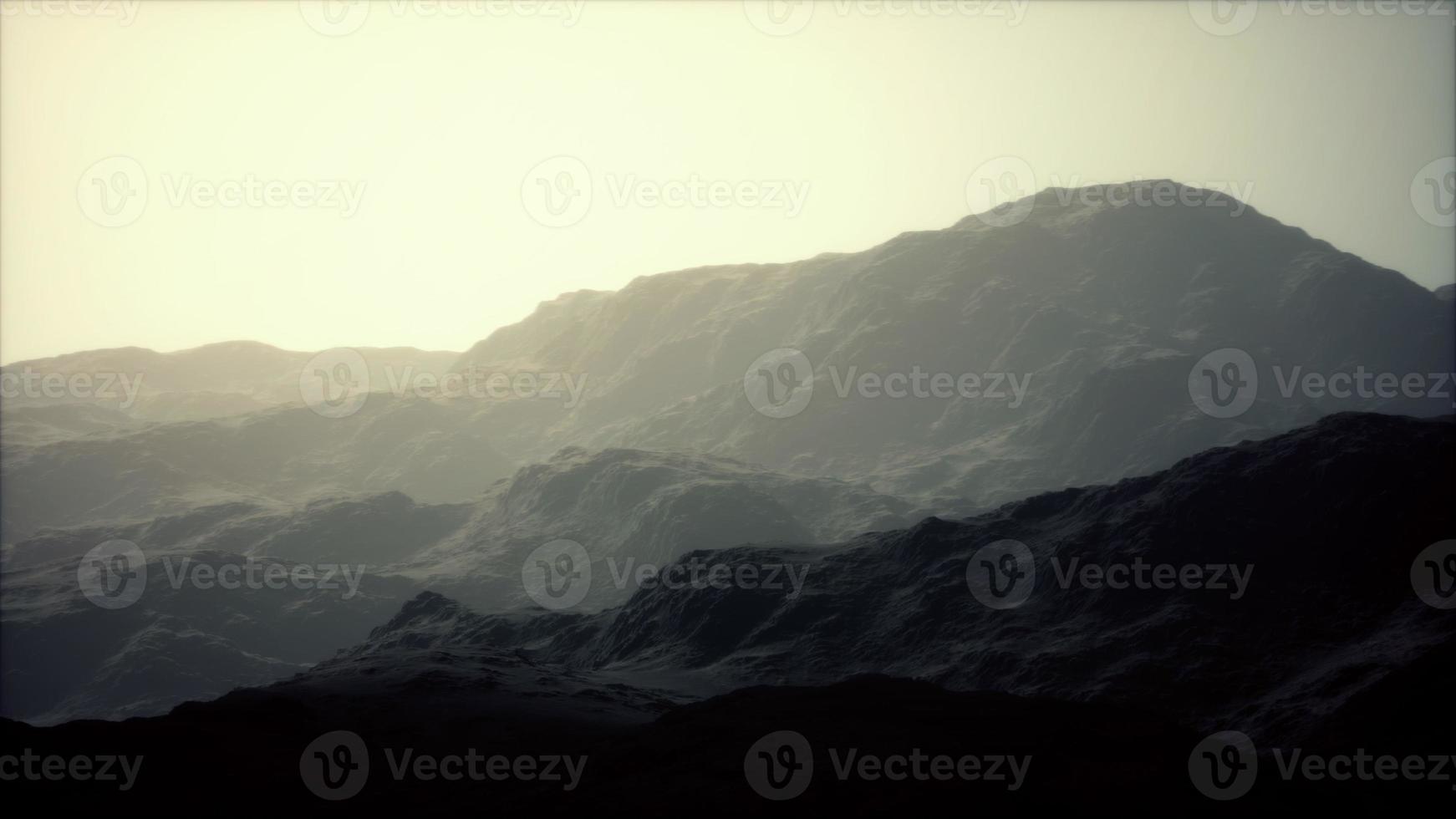 landscape of the Dolomites Mountain Range covered in the fog photo