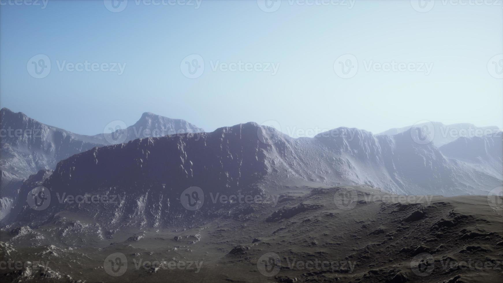 silhouette of swiss alps mountains in morning clouds photo