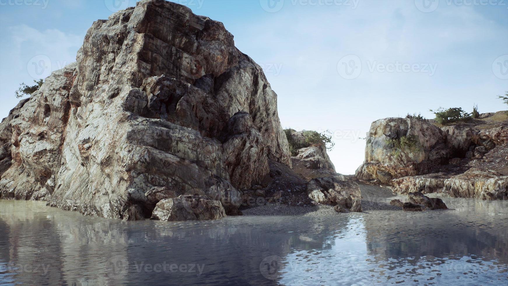 rocky tropical island in ocean photo