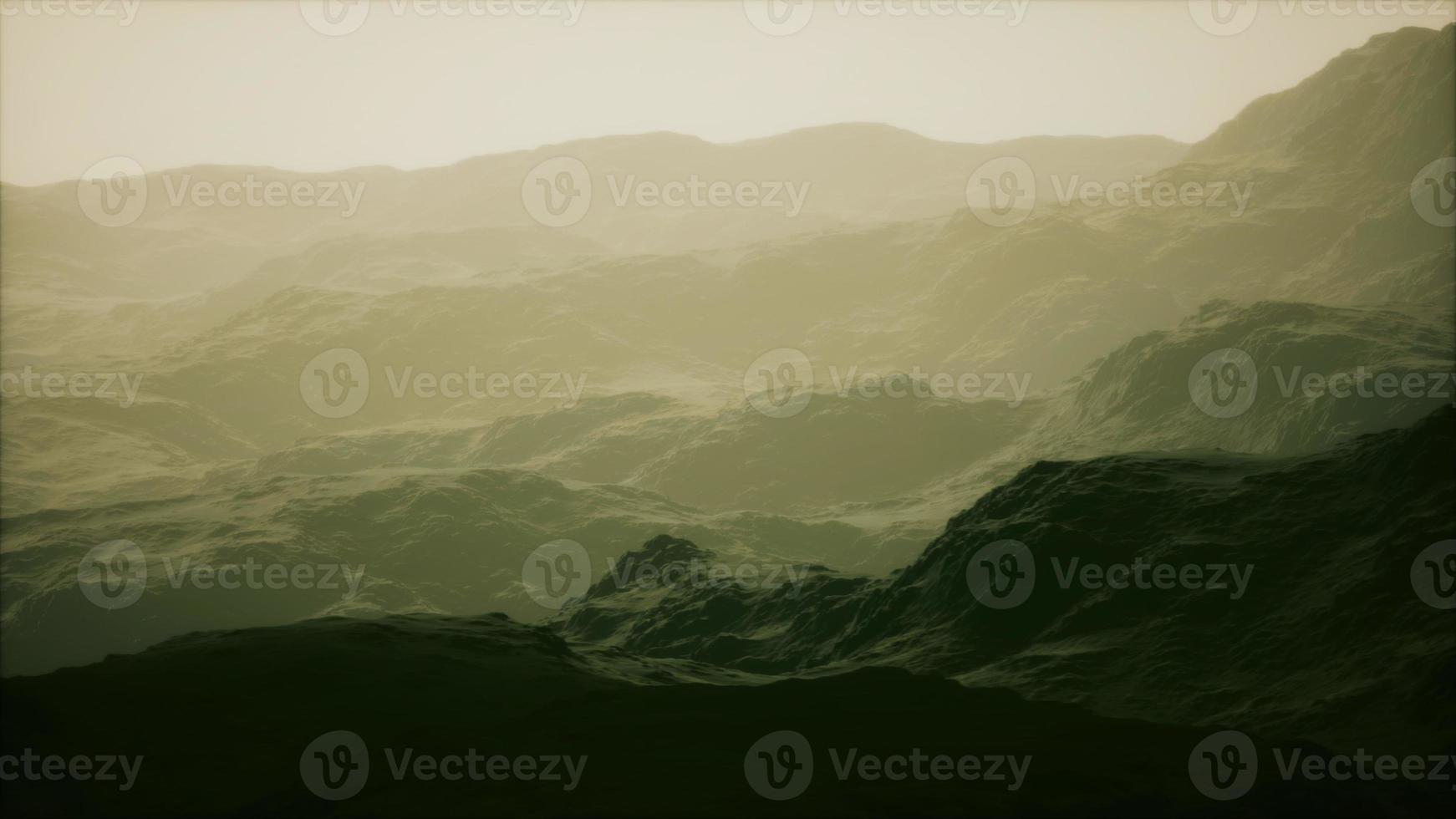 Rocks and mountains in deep fog photo