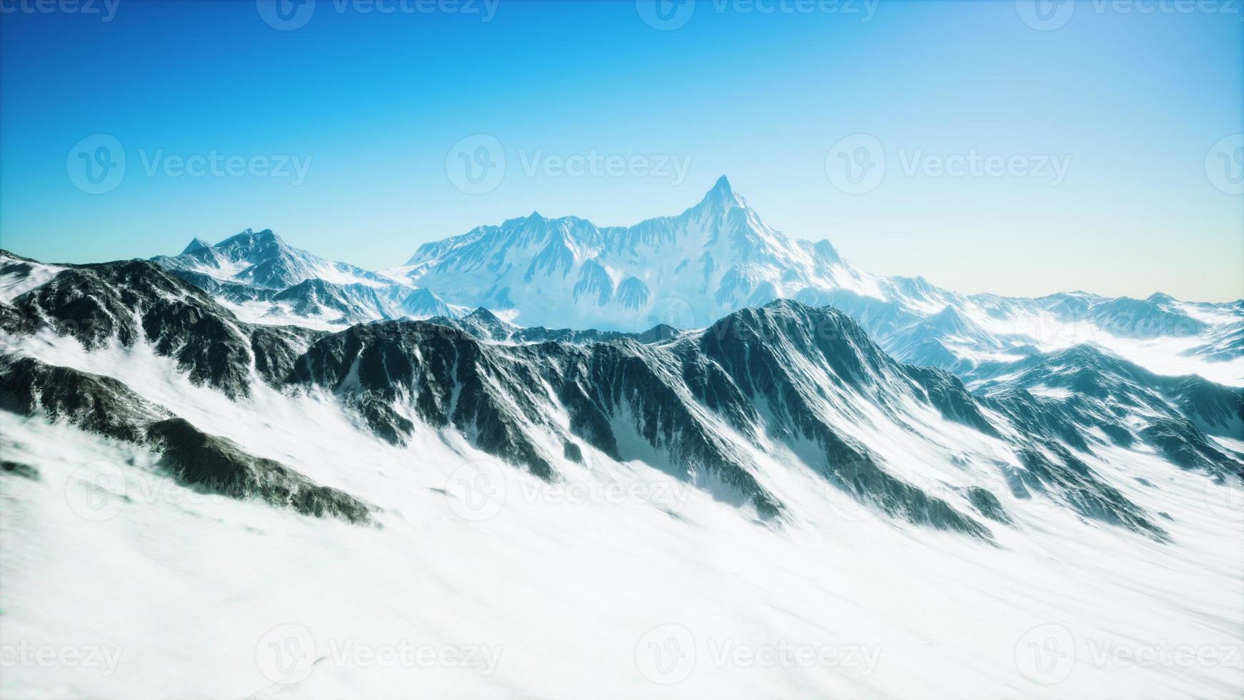 Panoramic view of the ski slope with the mountains photo