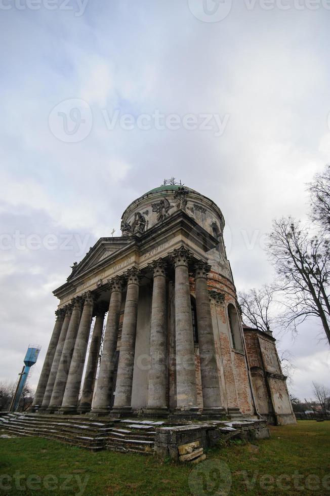 Roman Catholic Church of Saint Joseph. Old historic buildings detail stone wooden sculptures magnificent ornaments lamps street lamps details. Pidhirtsi village, Lviv Oblast, Ukraine OCTOBER 30, 2019 photo