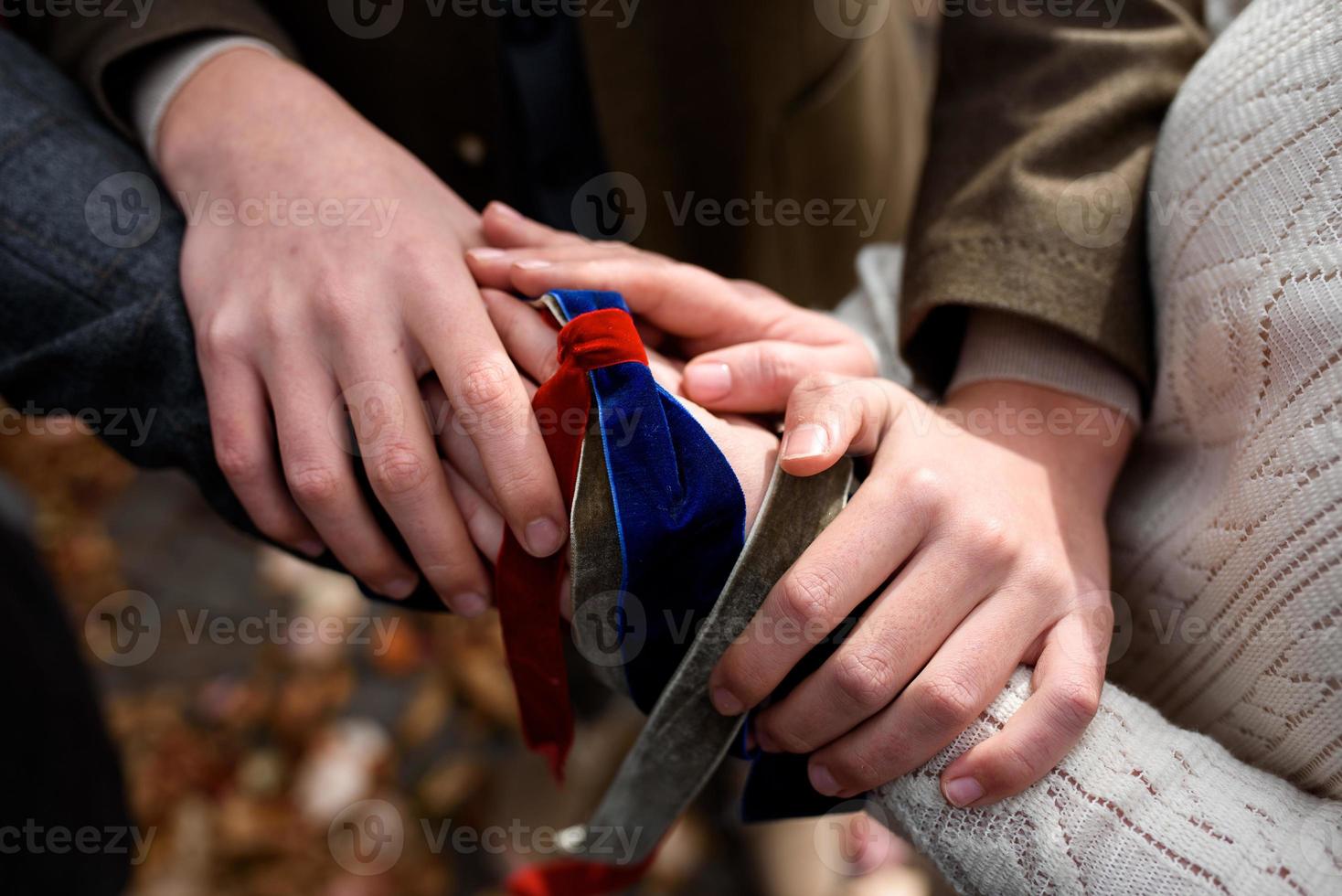 Celtic wedding. Groom and bride tied hands photo