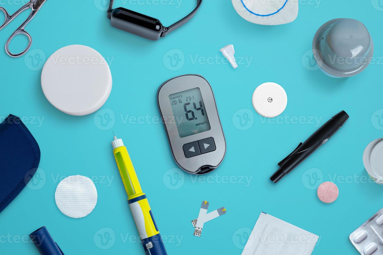 Diabetes supplies and devices on desk. Top view flat lay composition photo