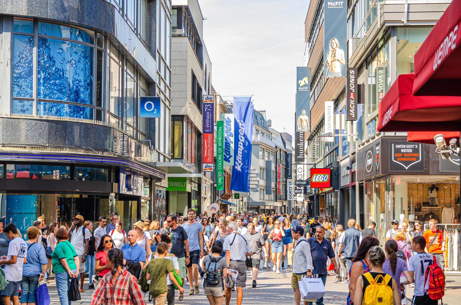 Cologne, Germany, August 23, 2019 crowd of people tourists walking down pedestrian shopping street Hohestrasse in Cologne photo