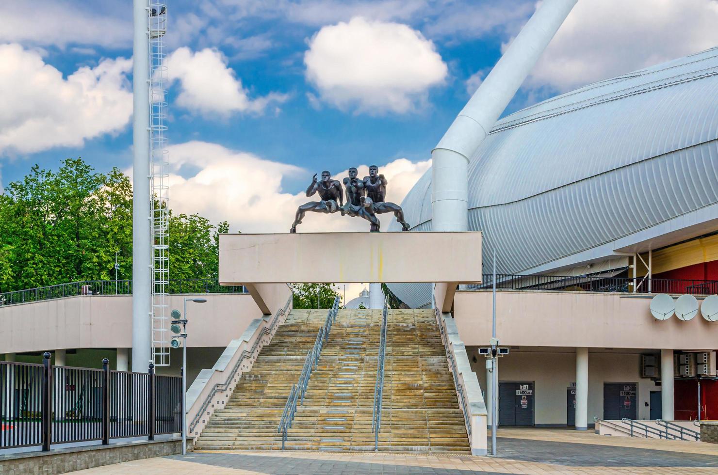 Dinamo National Olympic Stadium entrance with sculpture running men photo