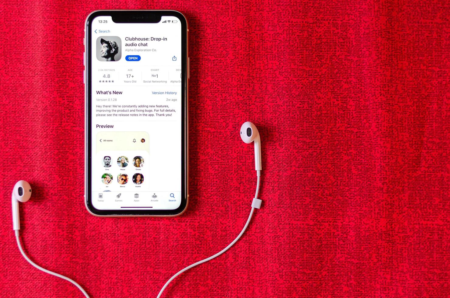 Clubhouse drop-in audio chat application view on smartphone screen photo
