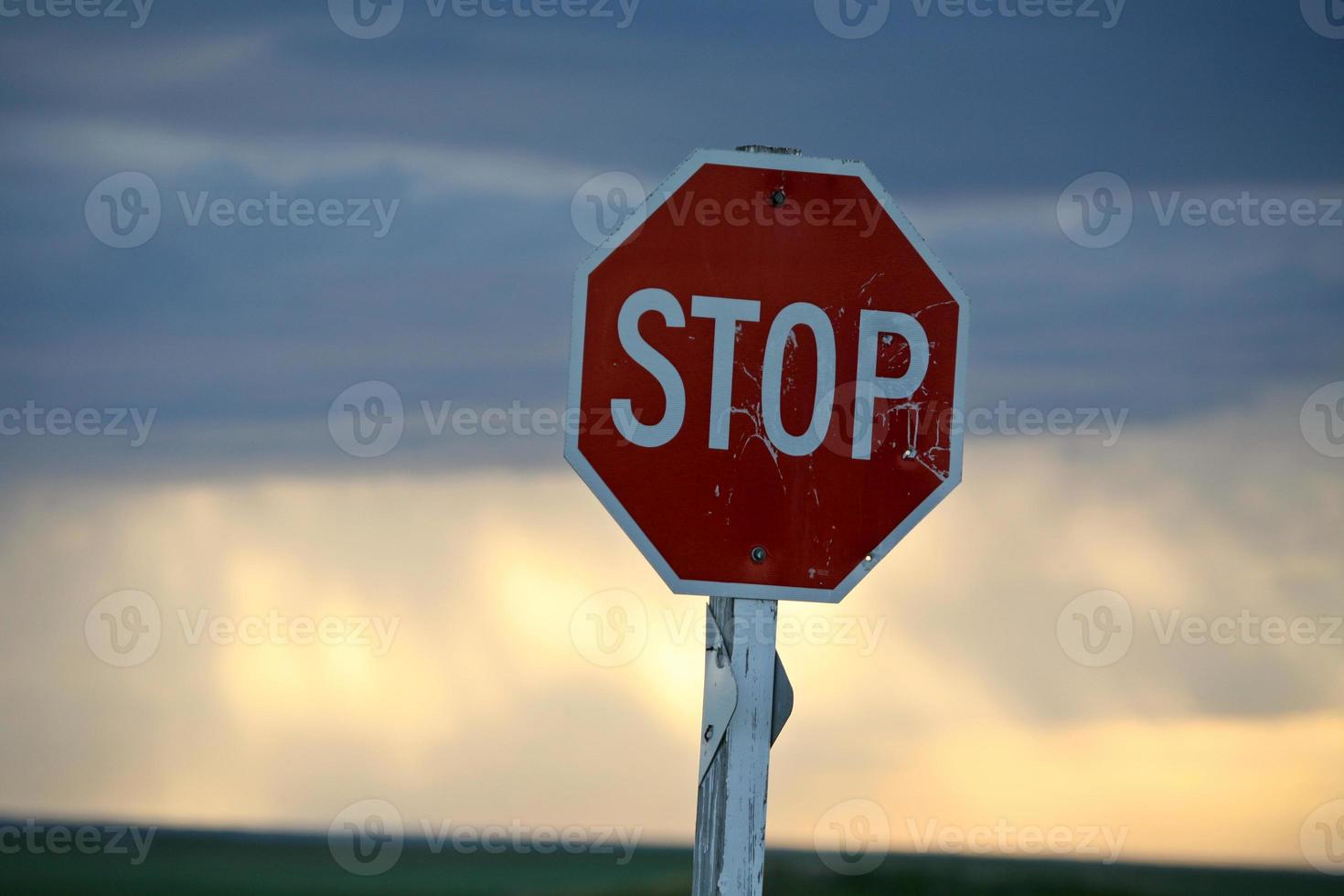Storm clouds building behind a Stop sign in Saskatchewan photo
