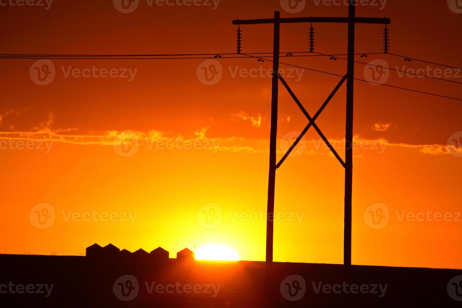 Gorgeous sunset behind Saskatchewan power towers photo