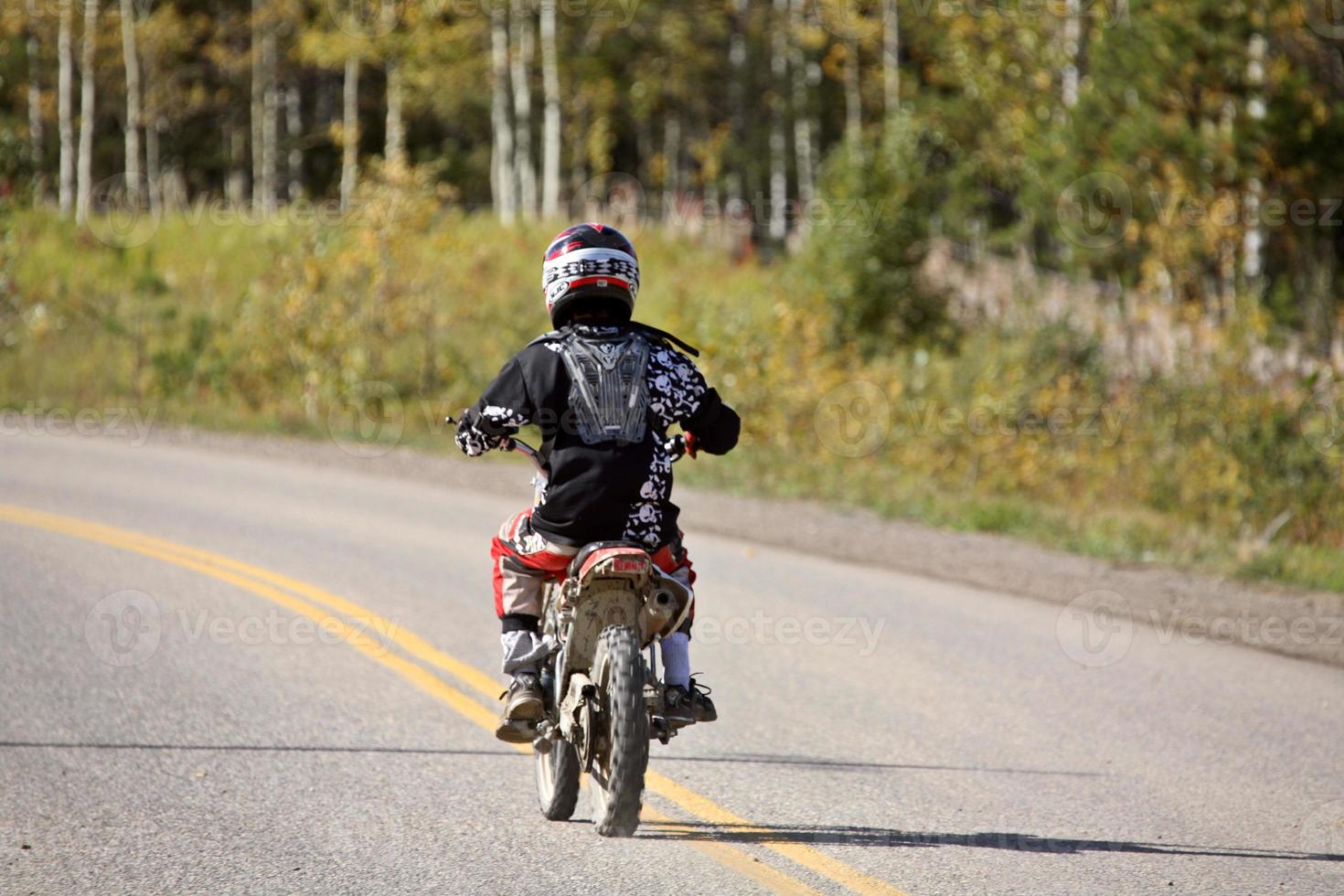 Dirtbiker on a Country Road in Alberta photo