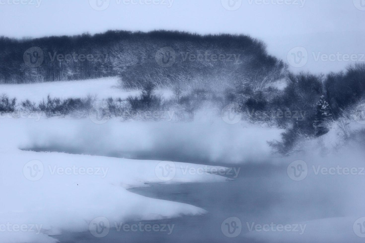 Mist coming off open water at Waterton Lake Alberta photo