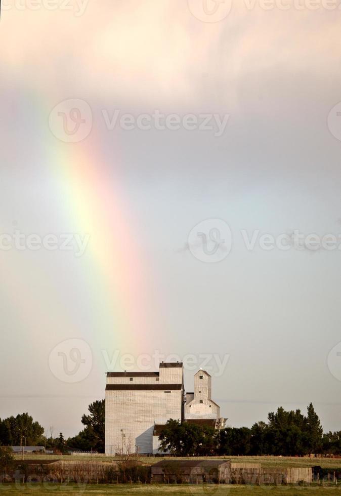 Rainbow touching down behind Bengough Saskatchewan photo