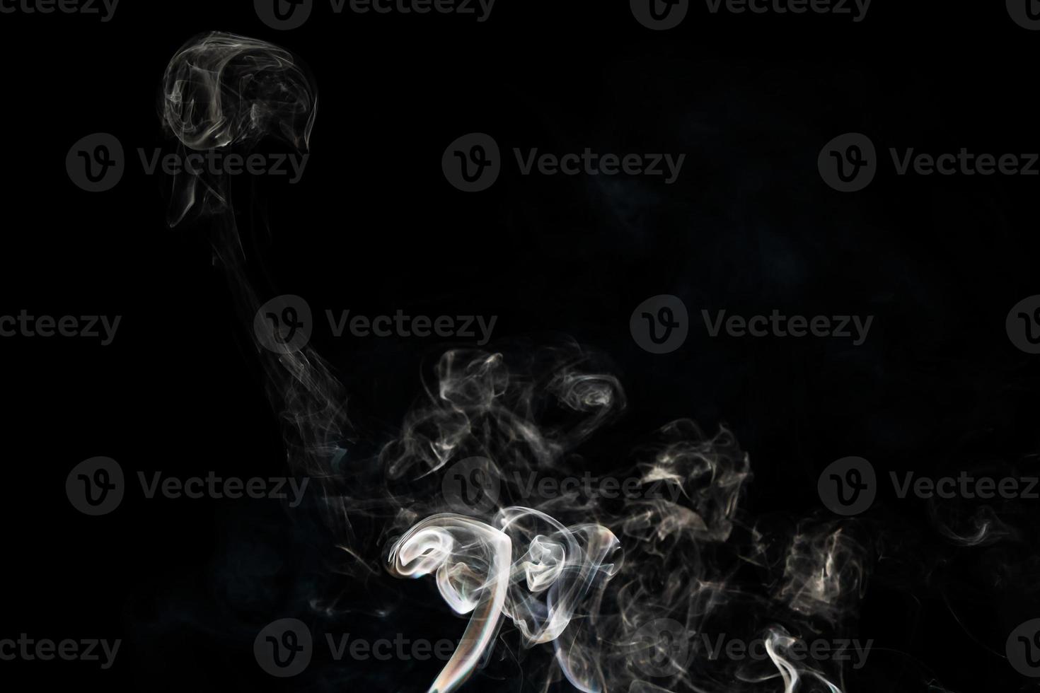 Smoke effect texture. Isolated background. Black and dark backdrop. Smokey fire and mistic effect. photo