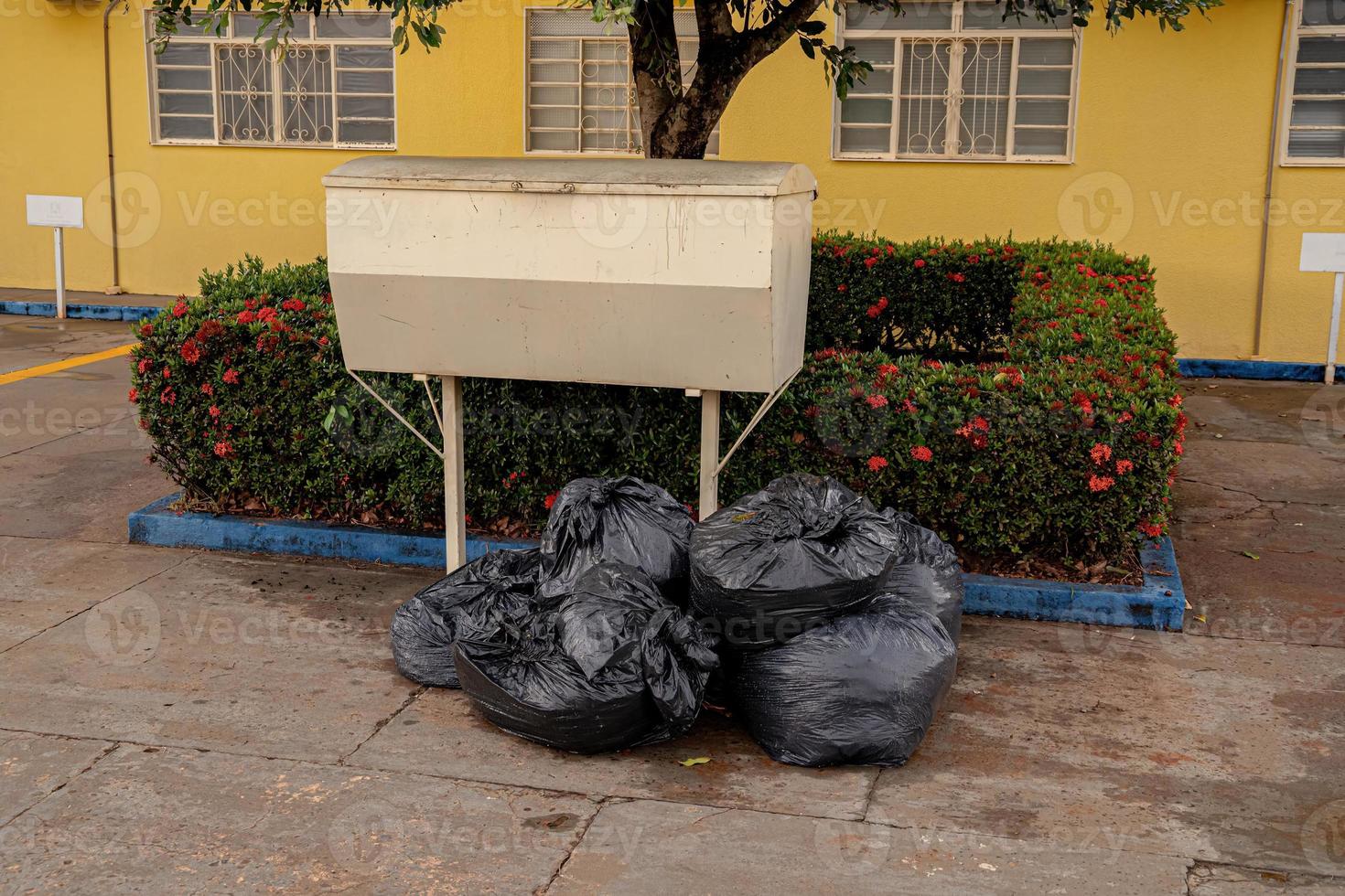 trash can with garbage bags photo