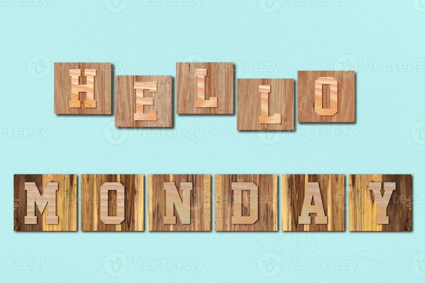 Hello Monday alphabet letters made from wooden on blue background photo