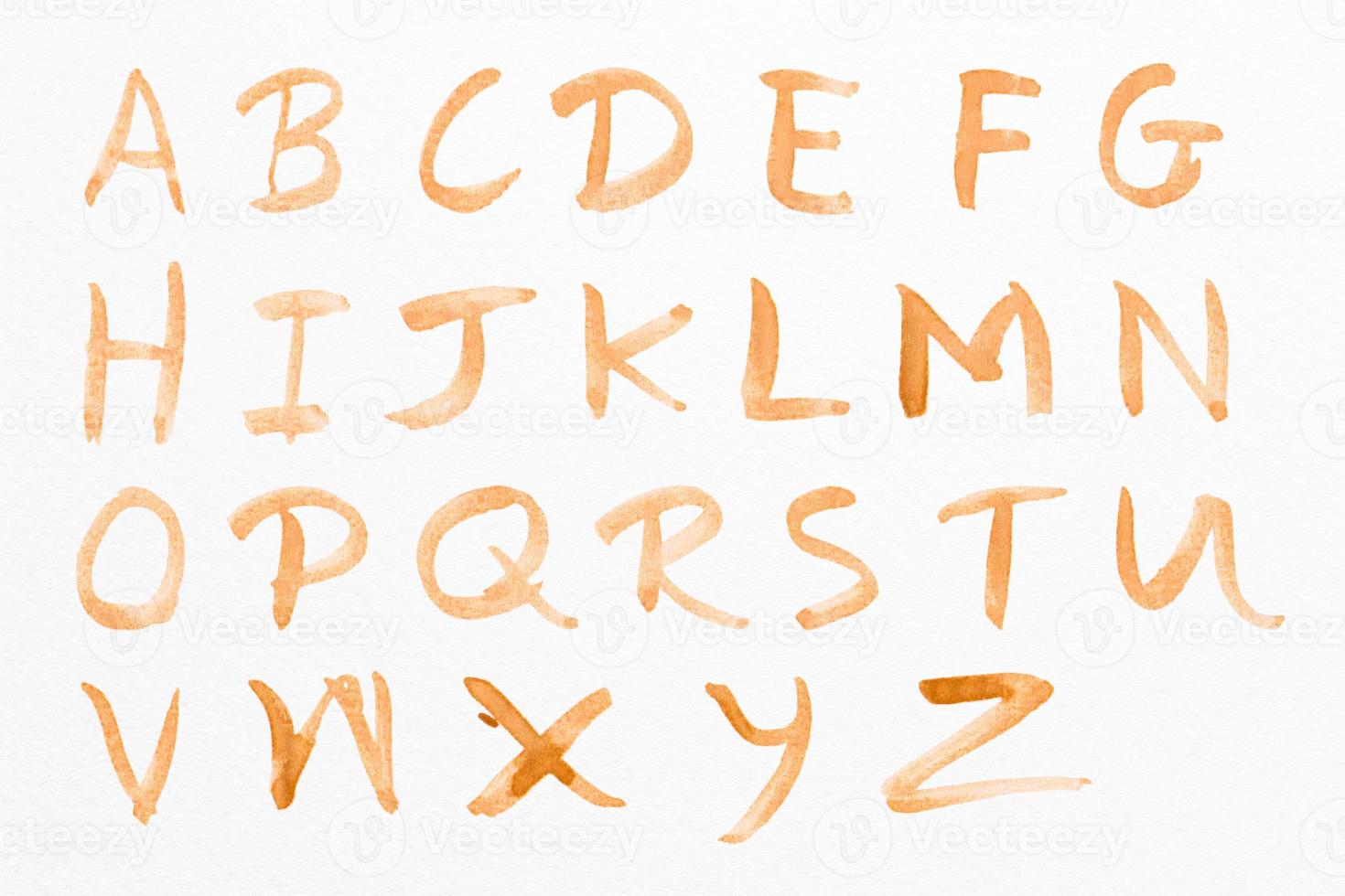 Letters A-Z with red watercolor on white paper background. Handwritten alphabet. photo