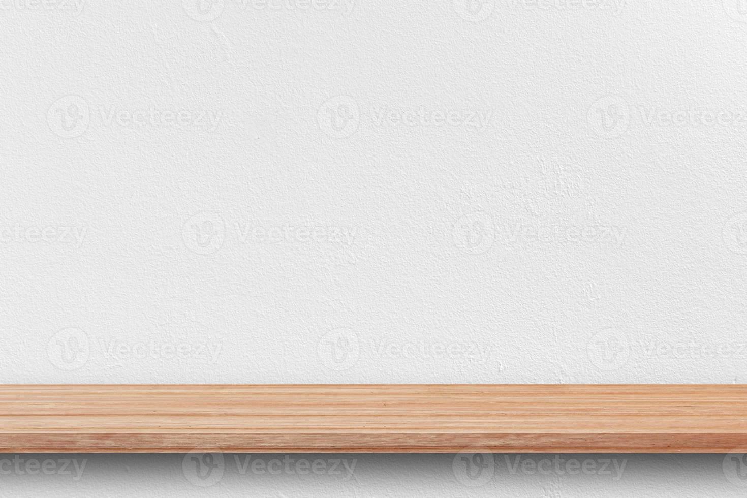 Front view of empty bookshelf and grey wall for product display or design mockup. photo