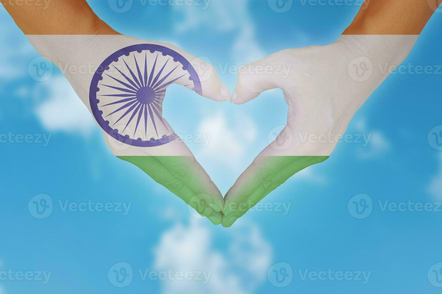 Indian flag painted on hands in heart shaped. photo
