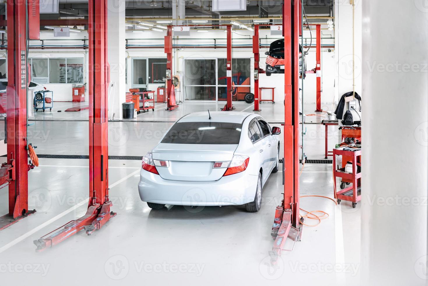 Car Auto Service and Vehicle Maintenance Workshop Center, Automobile Garage Shop and Spare Part Changing. Automotive Services Station. Business Car Repair and Check Up photo