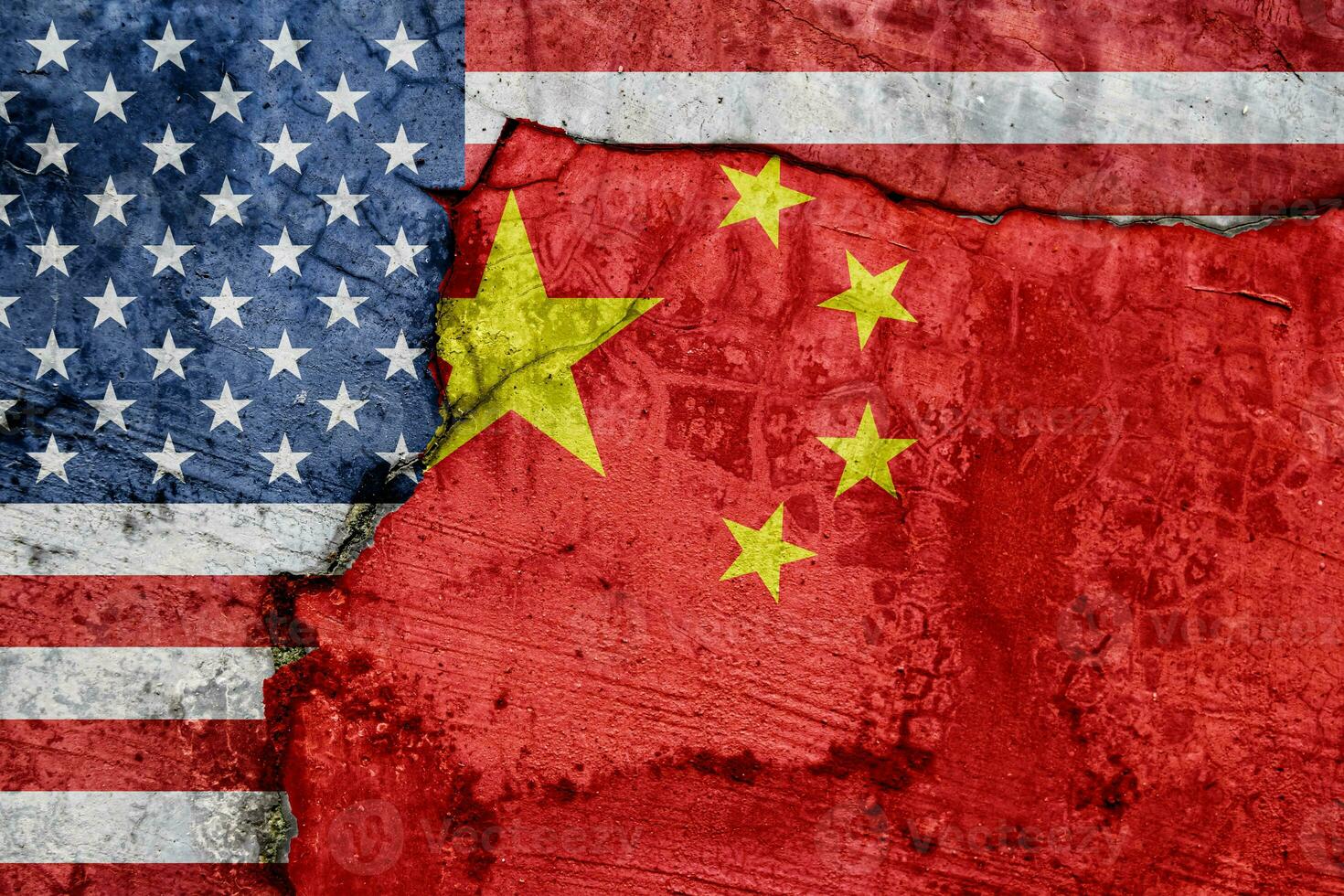 Flag of USA and China on cracked concrete wall background. photo