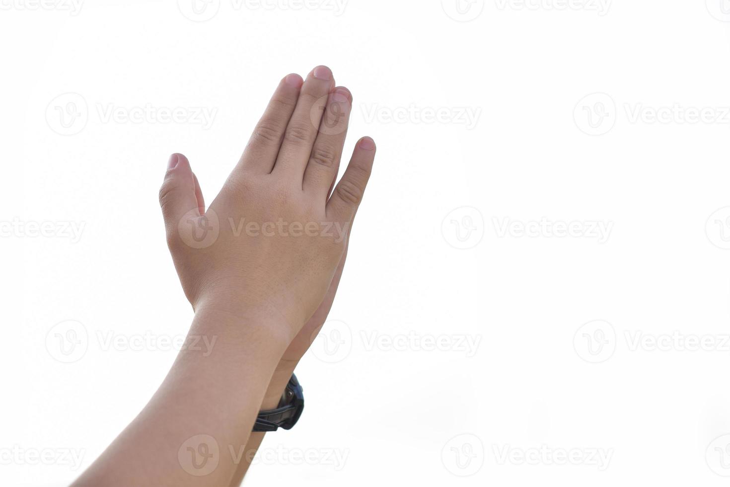 Children's hands praying Isolated on a white background. photo