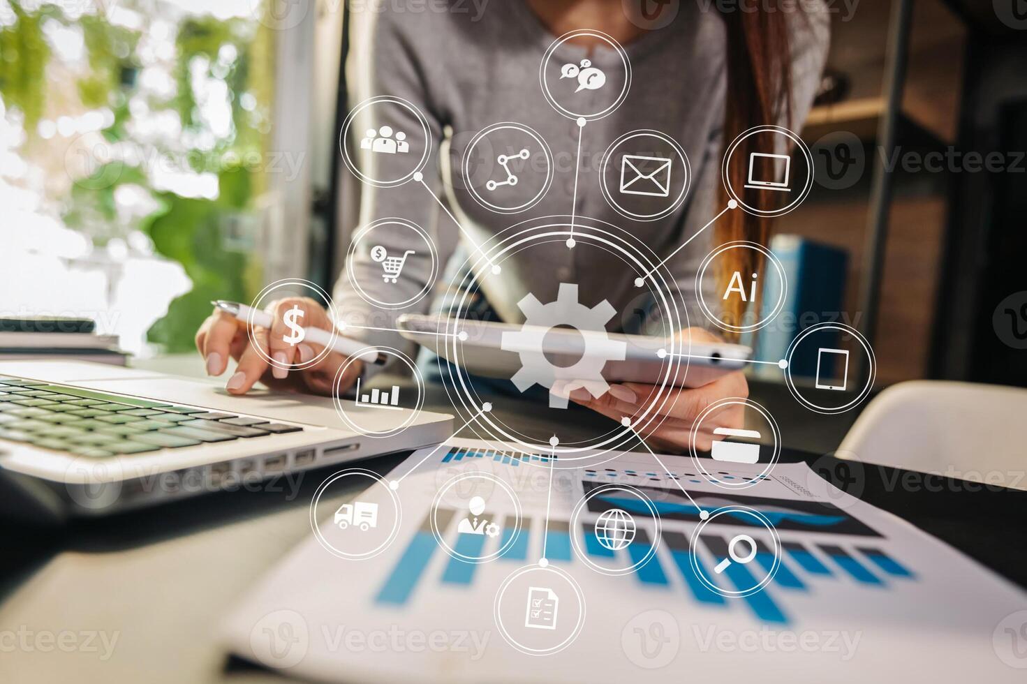 Businesswoman working with smart phone and laptop and digital tablet computer in  office with digital marketing media  in virtual icon photo