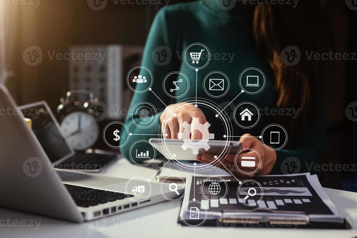 business documents on office table with smart phone and digital tablet and graph financial and man working photo